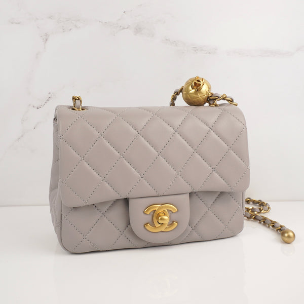 CHANEL 
Lambskin Quilted Mini Pearl Crush Flap Light Grey